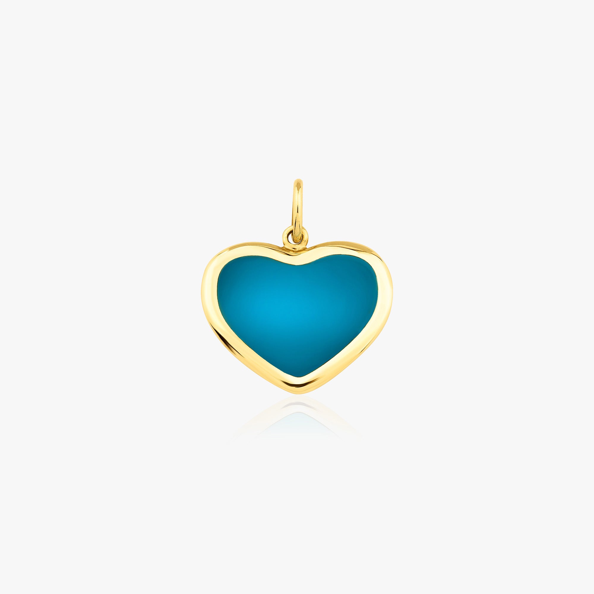 A 14k yellow gold large ocean blue heart pendant