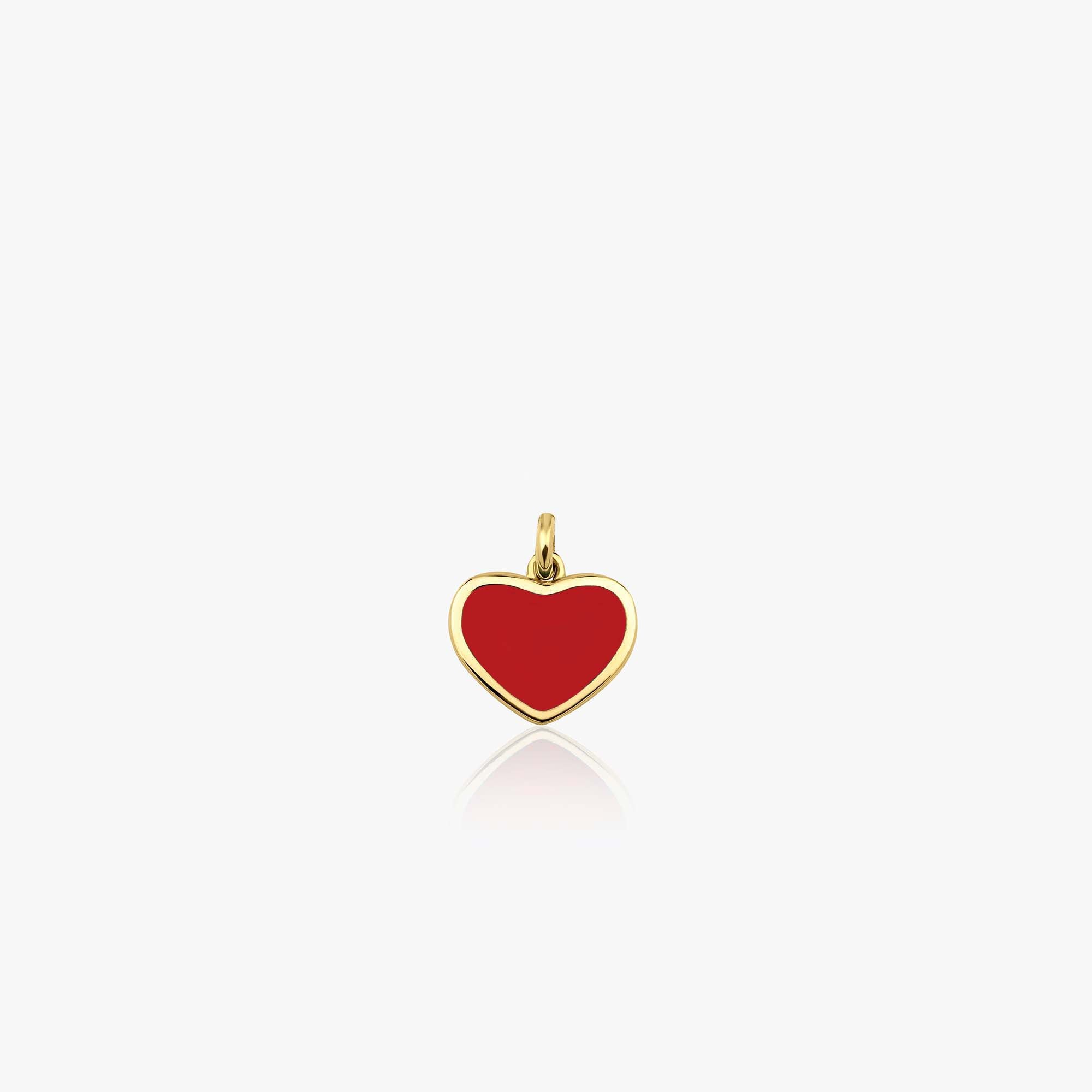 A medium sized 14k yellow gold red heart pendant shown on a white background
