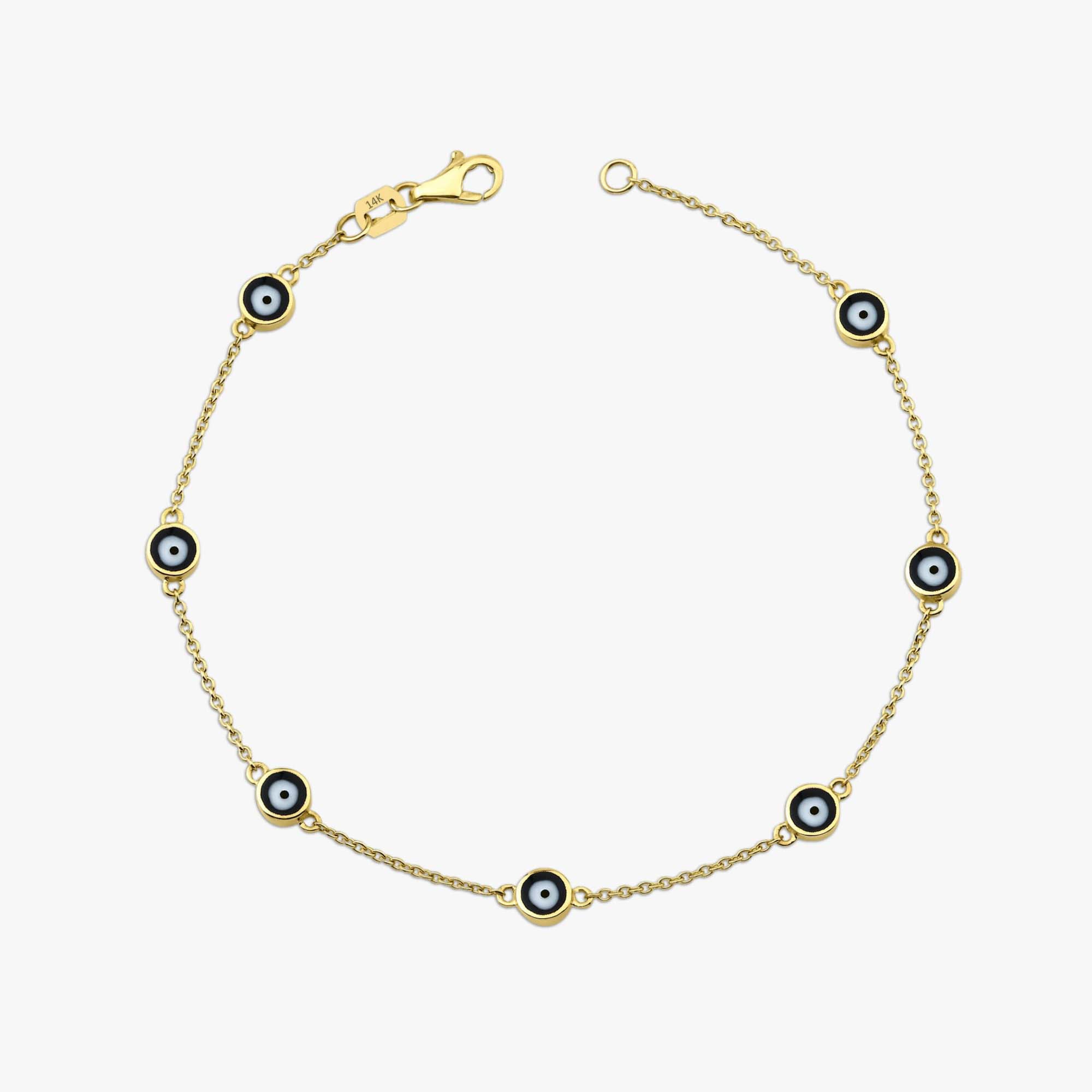 14k yellow gold black evil eye bracelet with 7 evil eyes shown on a white background