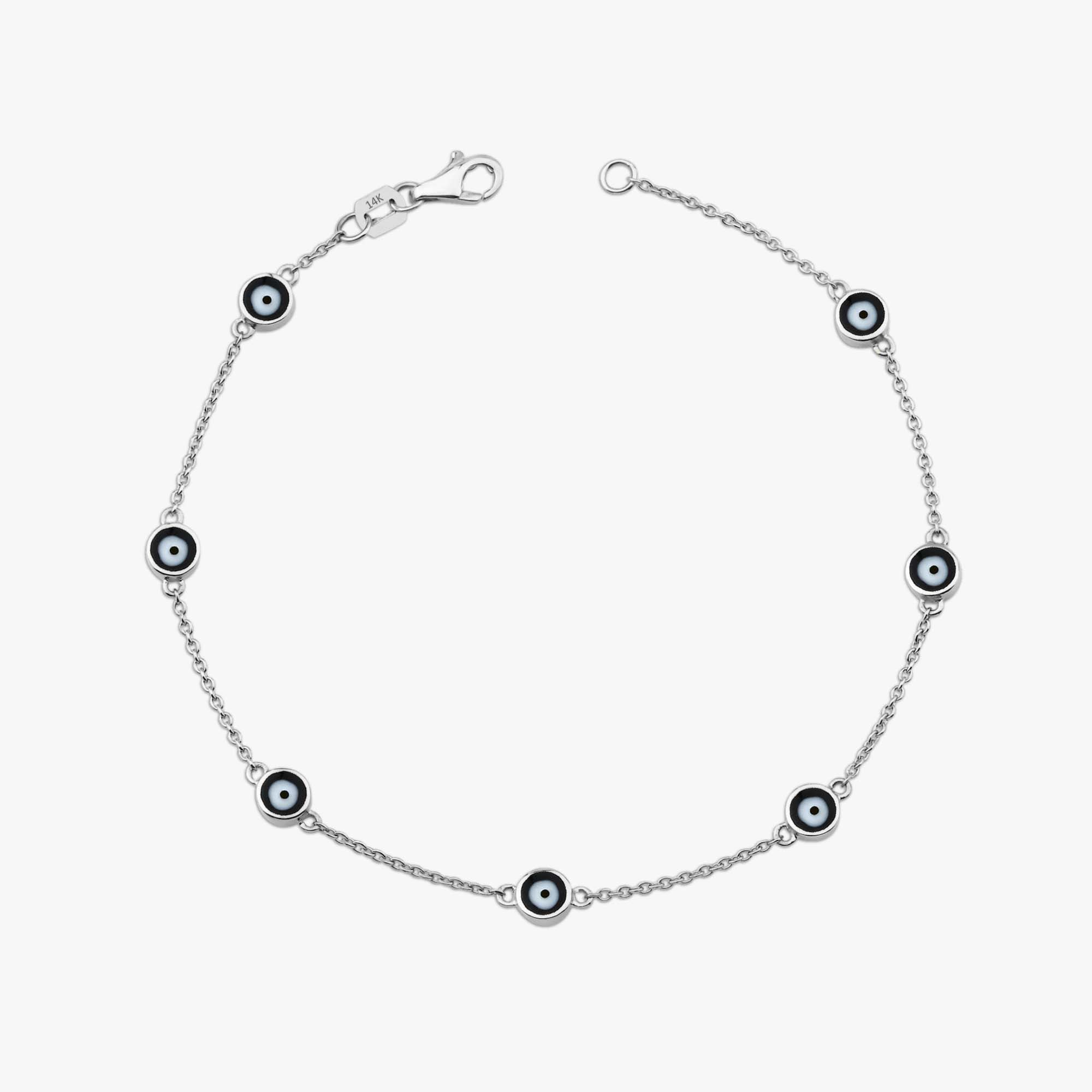 14k white gold black evil eye bracelet with 7 evil eyes shown on a white background
