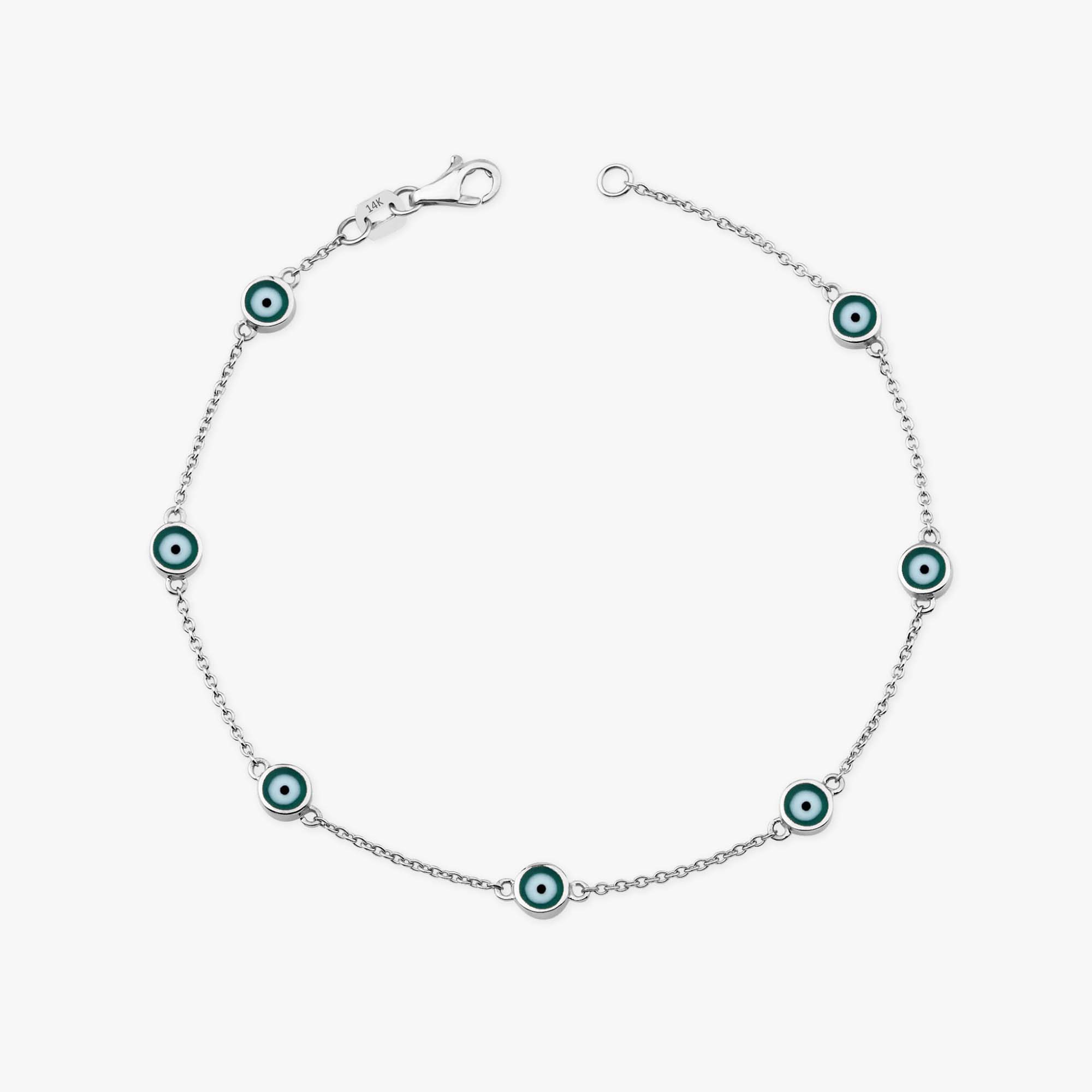 14k white gold evil eye bracelet with 7 green evil eyes shown on a white background