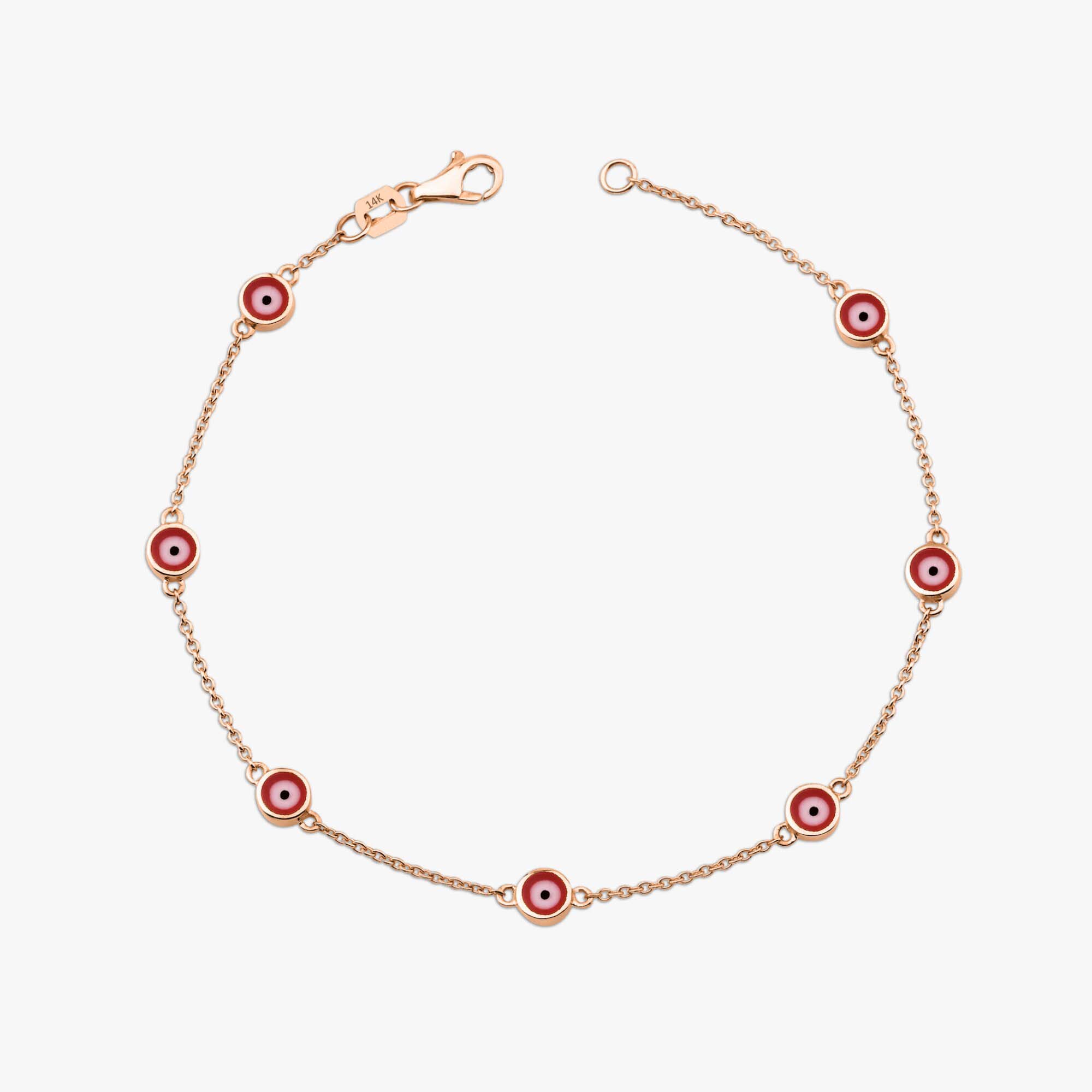 14k rose gold red evil eye bracelet with 7 evil eyes shown on a white background