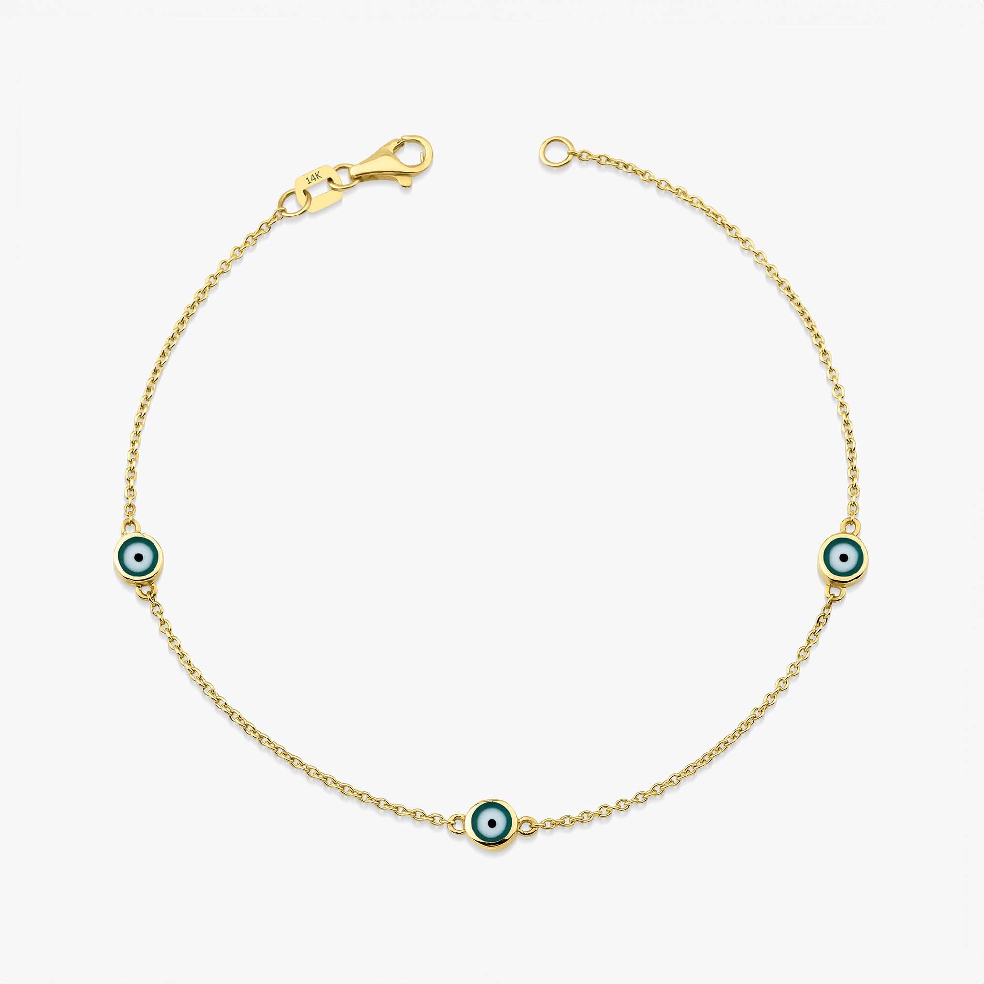 14 karat yellow gold three green evil eye bracelet with lobster clasp on a white background