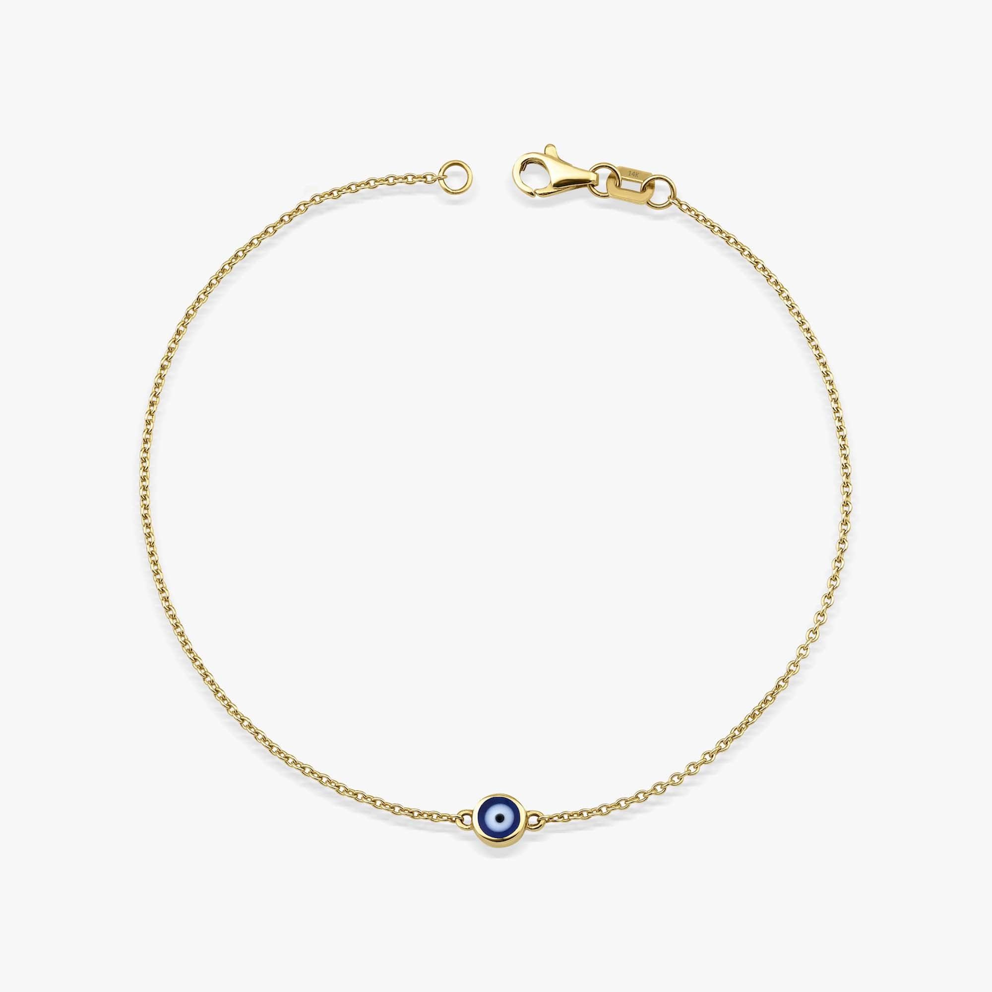 14K Yellow Gold bracelet with a navy blue evil eye charm on a white background