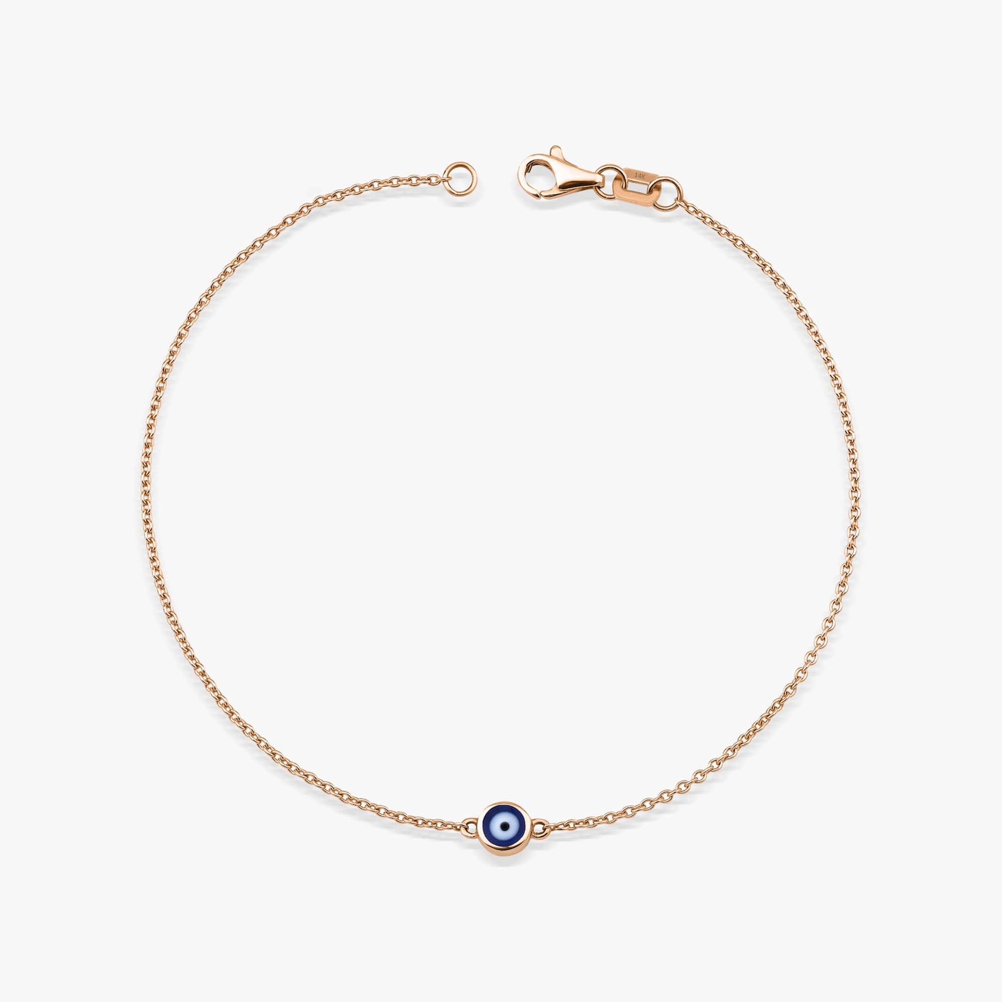 14K Rose Gold bracelet with a blue evil eye charm on a white background