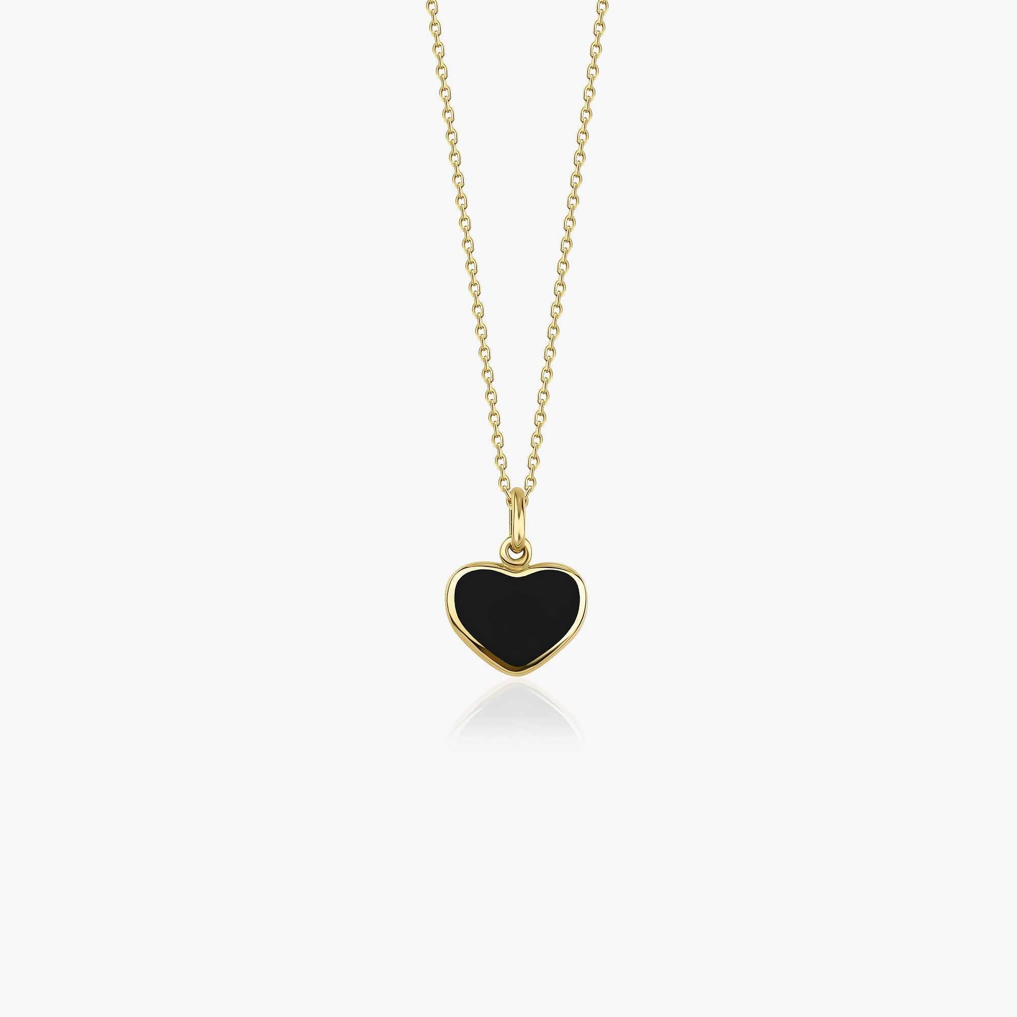 A dainty black heart necklace made of 14K solid gold with a yellow gold chain, displaying the black heart pendant against a white background.