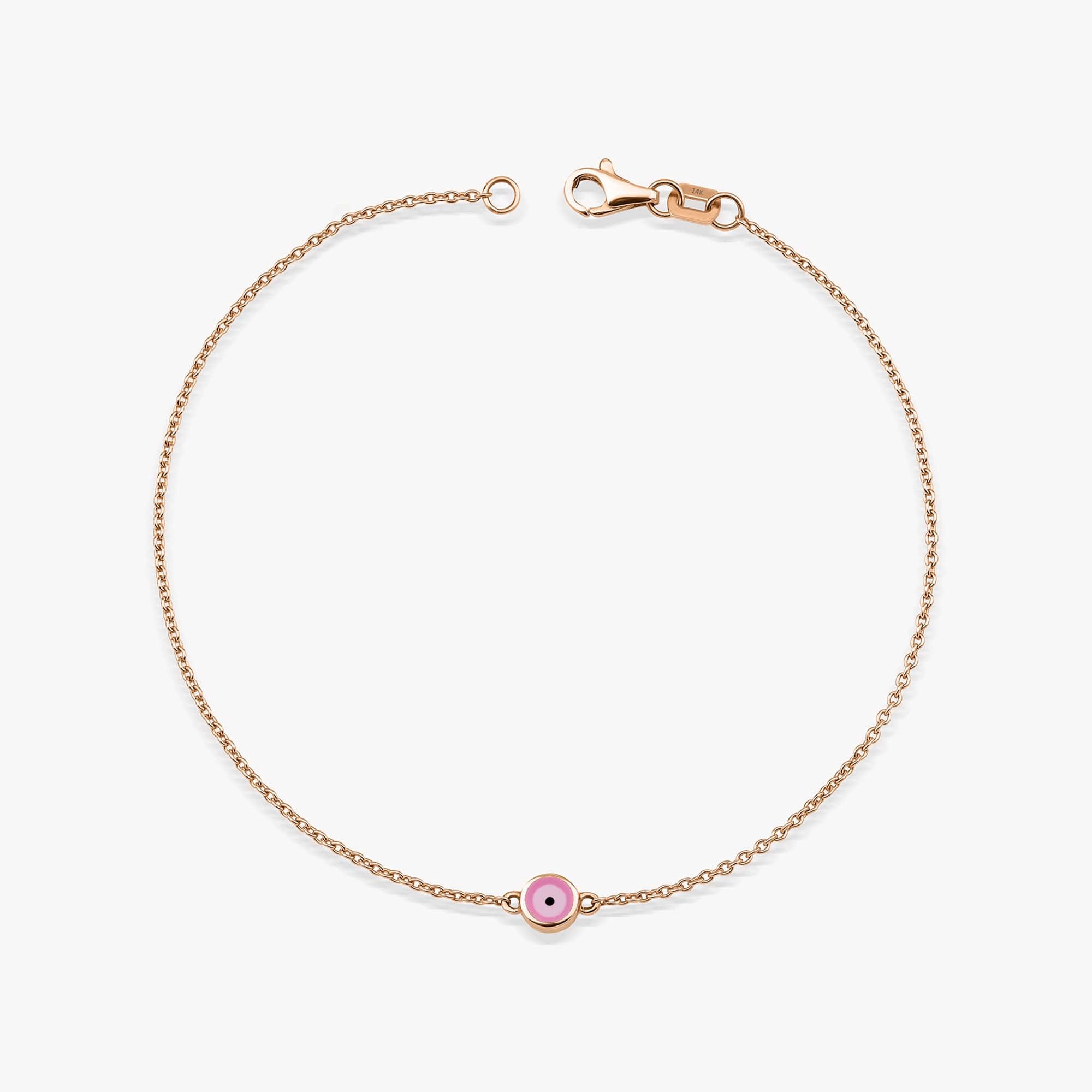 A 14K rose gold bracelet with a double-sided pink enamel evil eye design, featuring a solid gold chain and a gold lobster clasp.