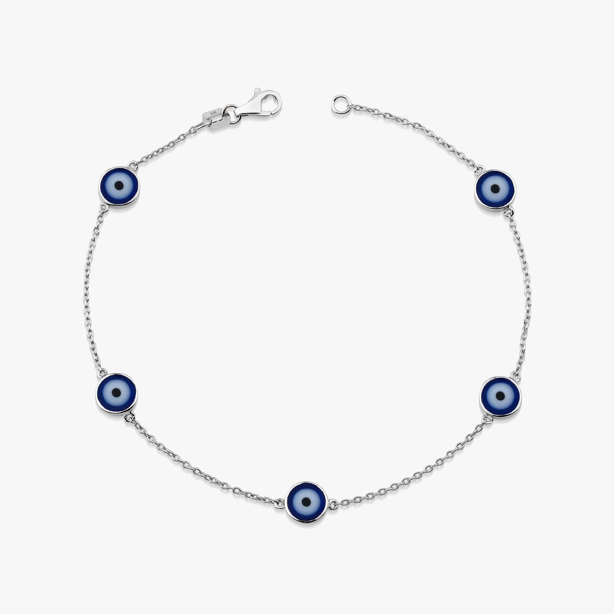 14k white gold evil eye bracelet with 5 navy blue evil eye charms on a white background