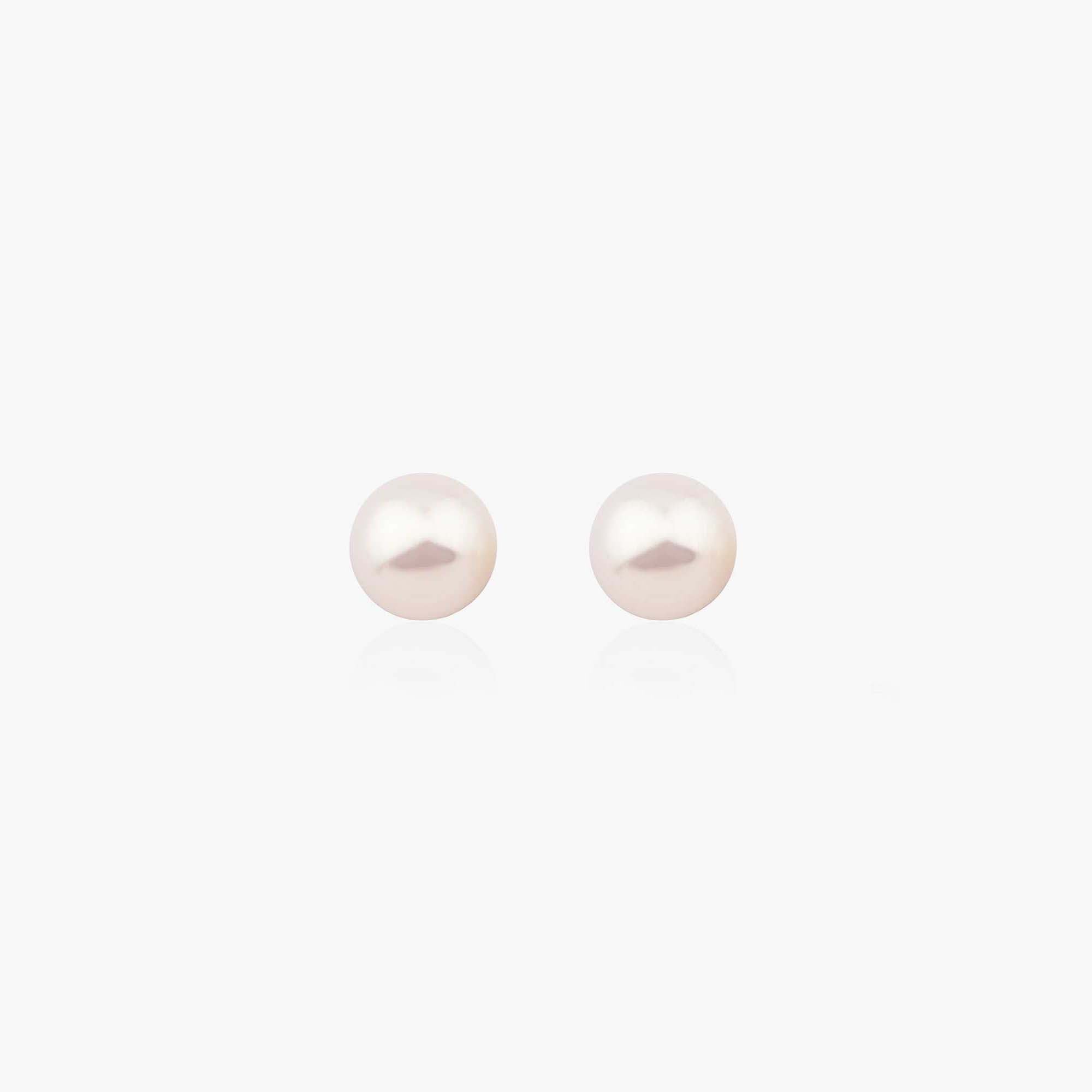 Pair of pearl earrings on a white background