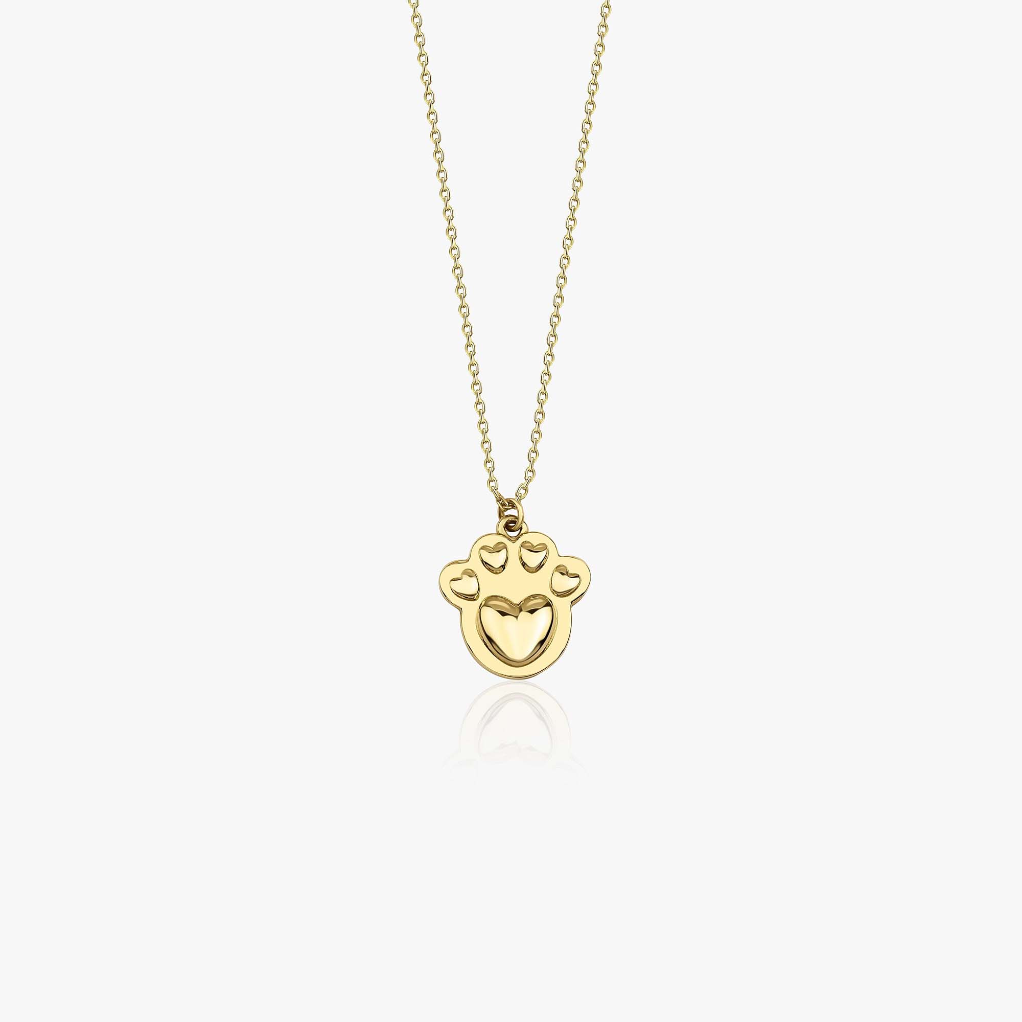 A 14k yellow gold paw necklace with hearts placed inside the paw shown on a white background.