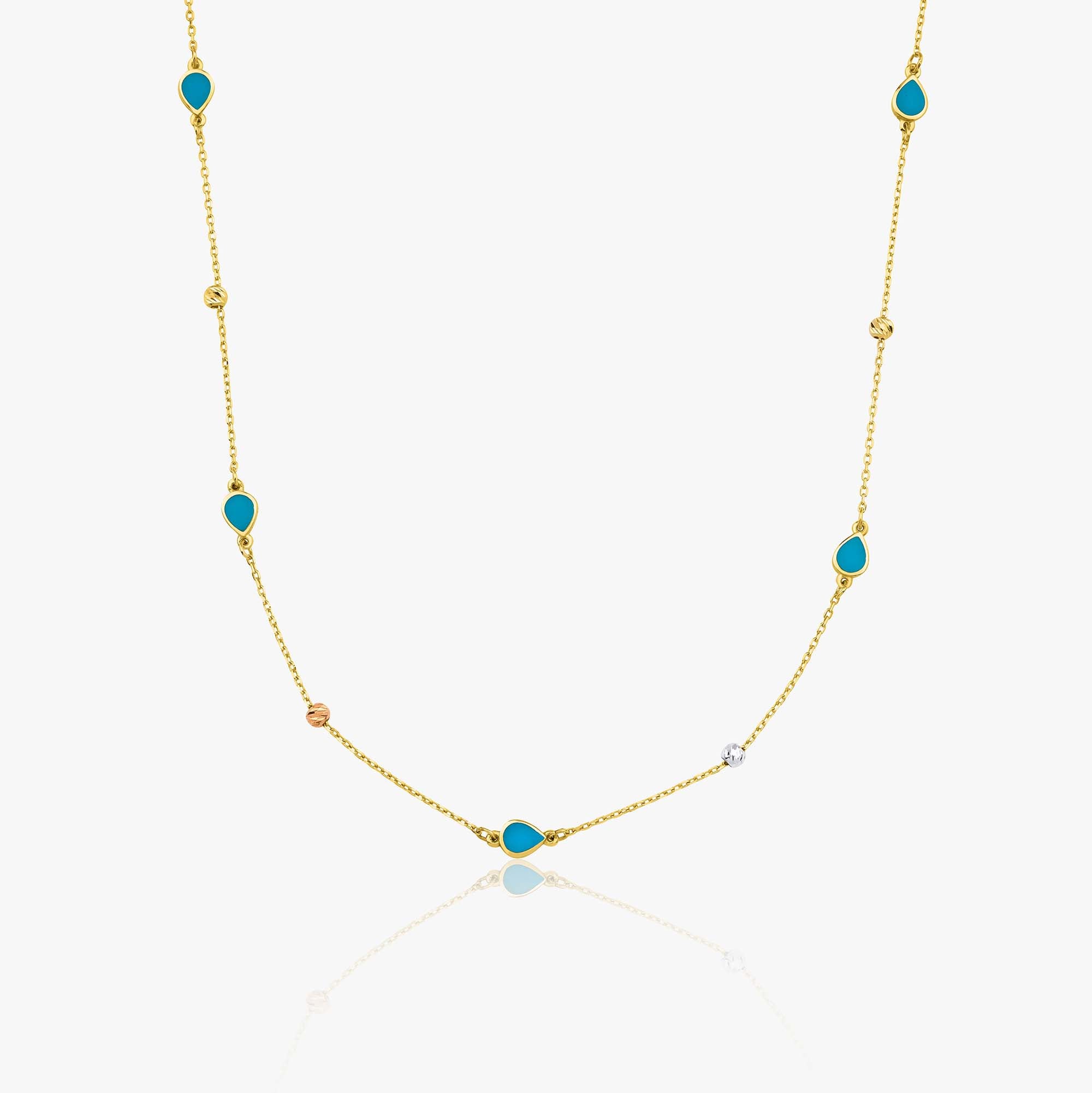 A 14k yellow gold raindrop station necklace shown in a white background