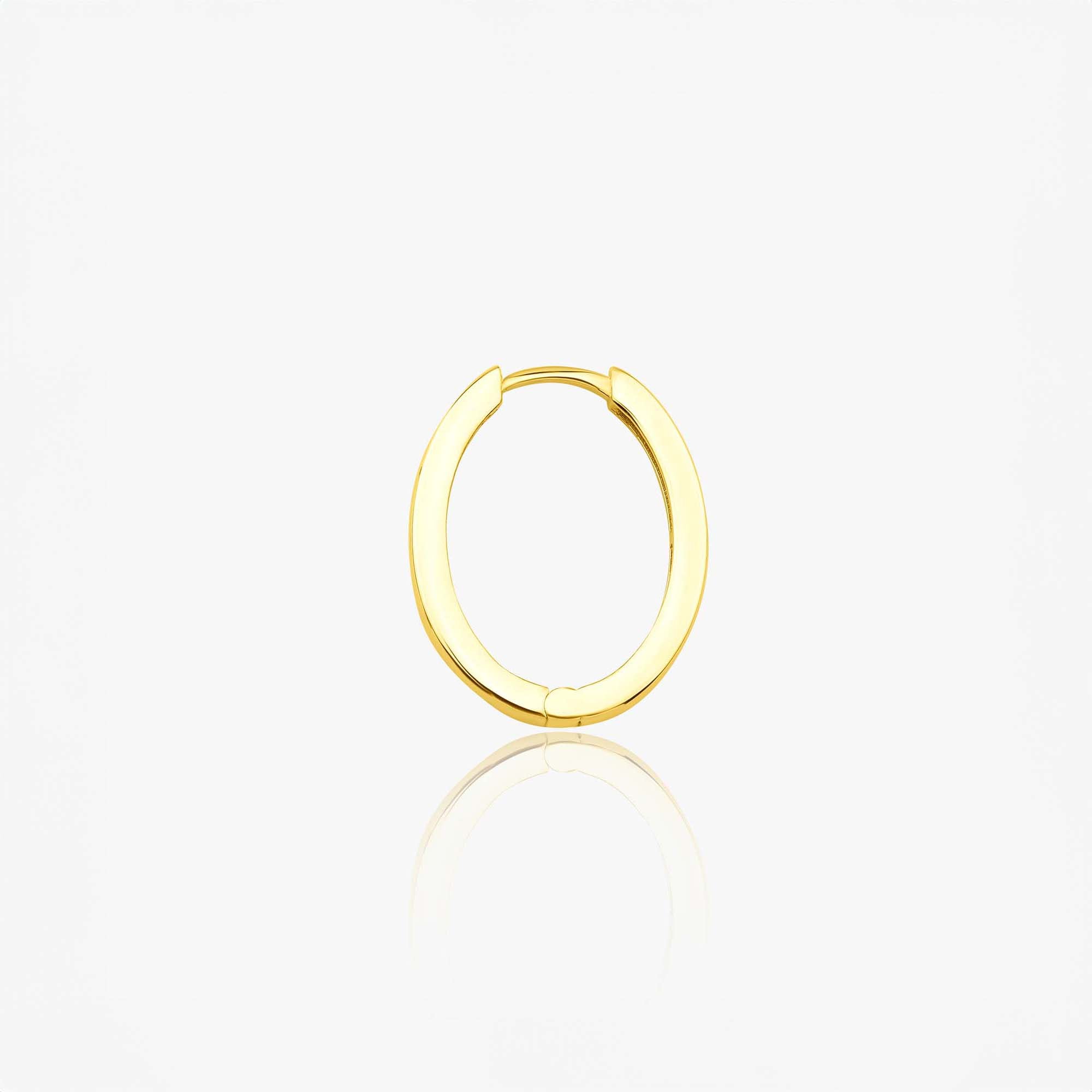 A single 14k yellow gold oval shaped hoop shown sideways on a white background.