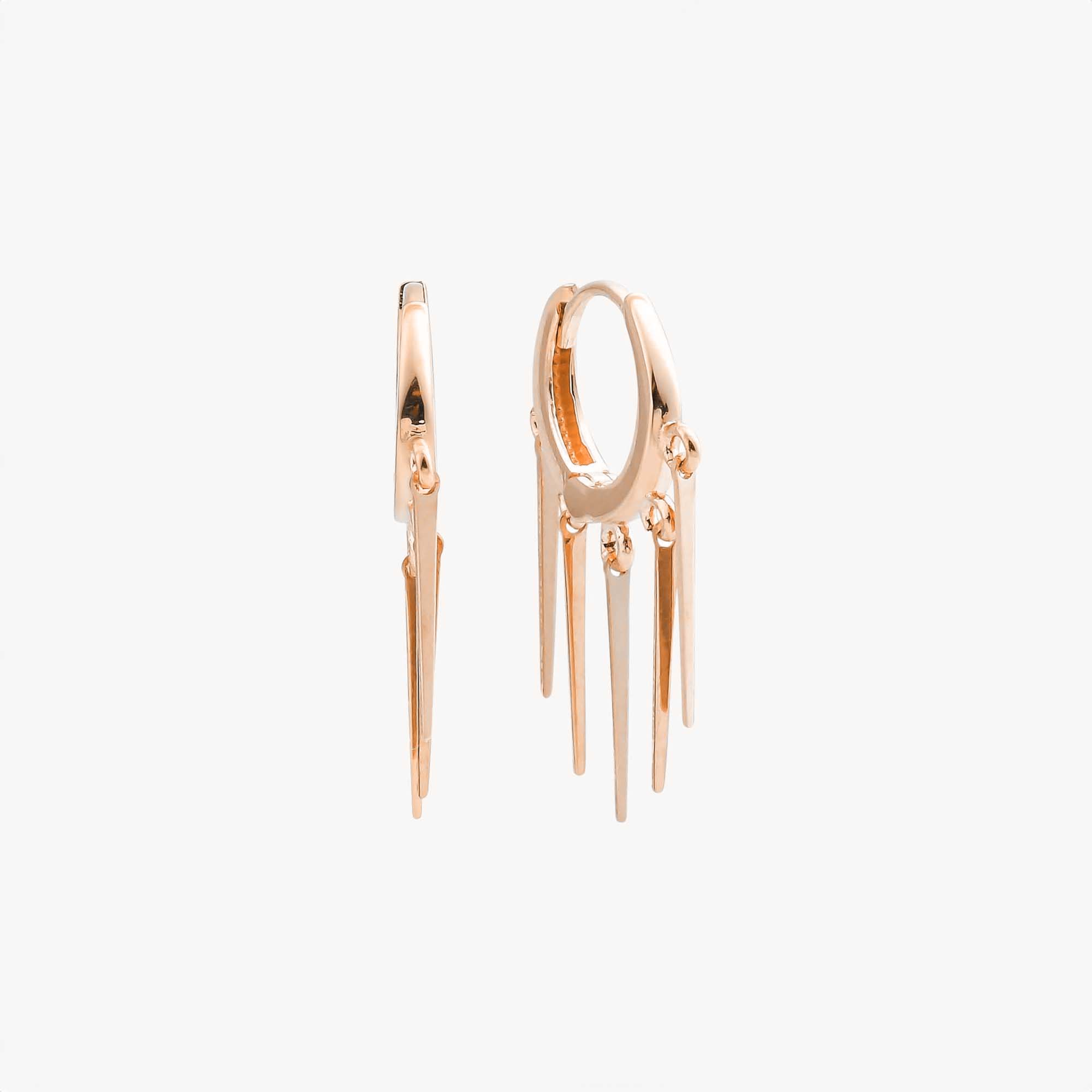 A pair of 14K rose gold hoops with dangle spikes design shown on a white background.
