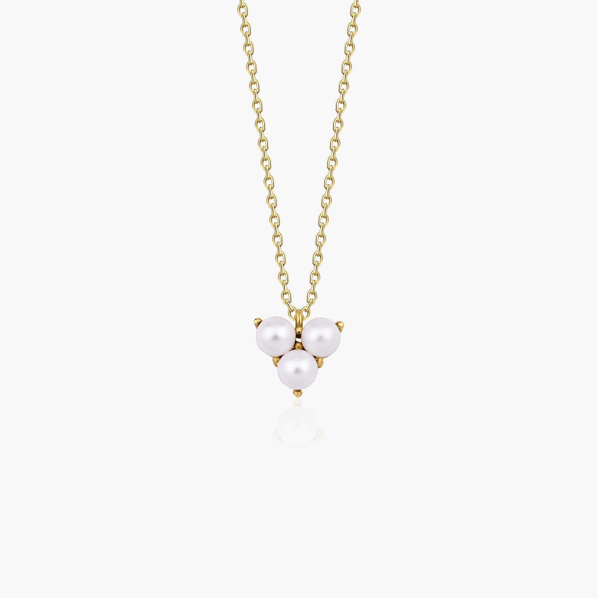 A 14k yellow gold pearl necklace with three freshwater pearls on the pendant shown on a white background.