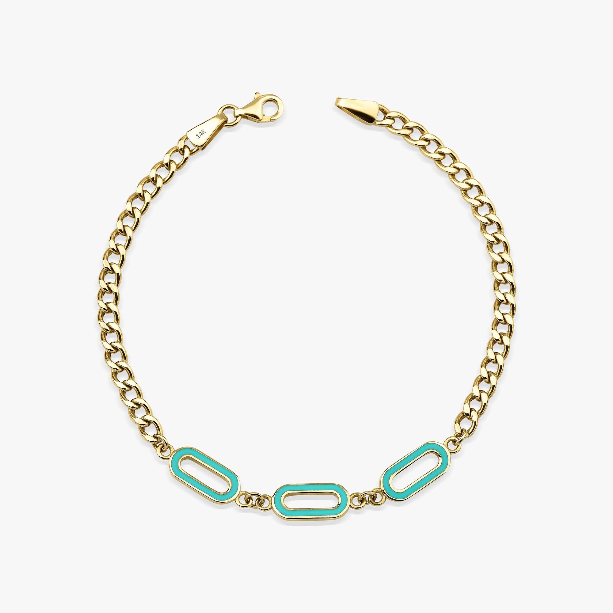 A 14K gold solid oval link chain bracelet with turquoise enamel accents on the central links, displayed against a white background.