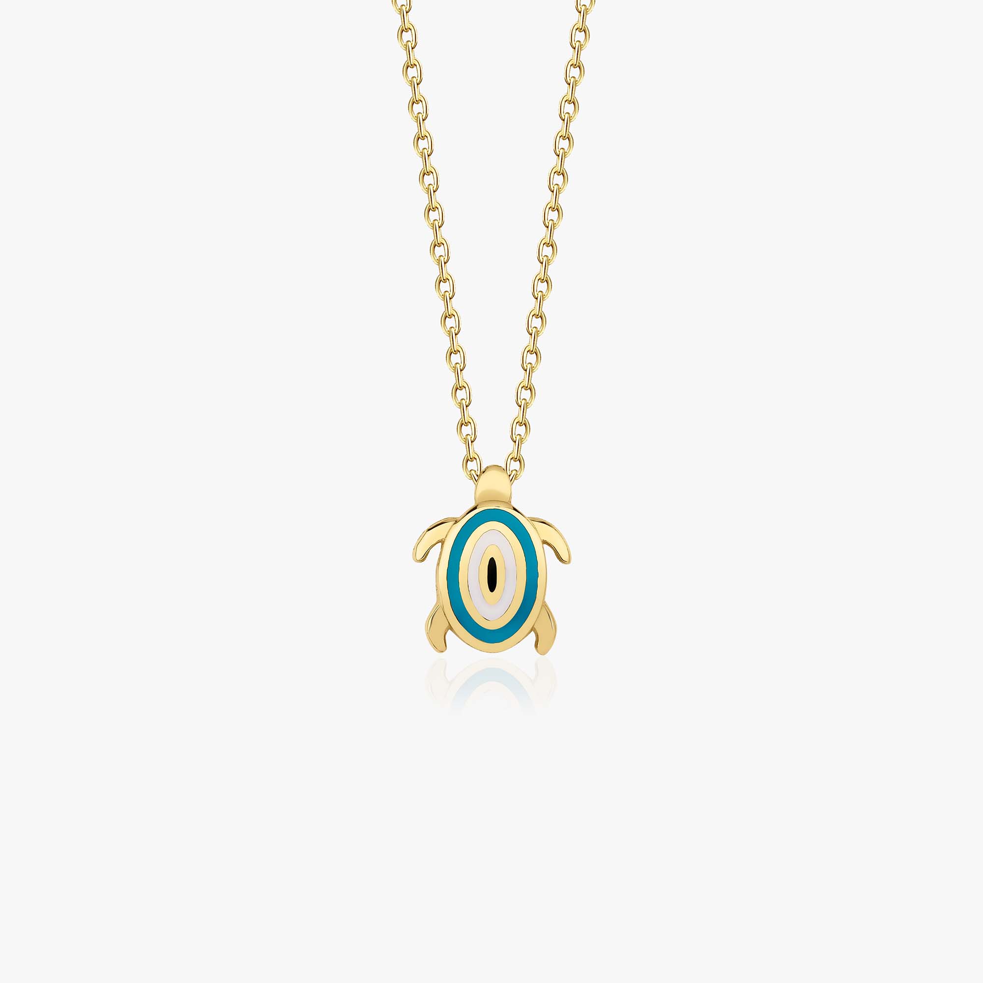 A 14k yellow gold turtle necklace with an evil eye at its center shown on a white background.