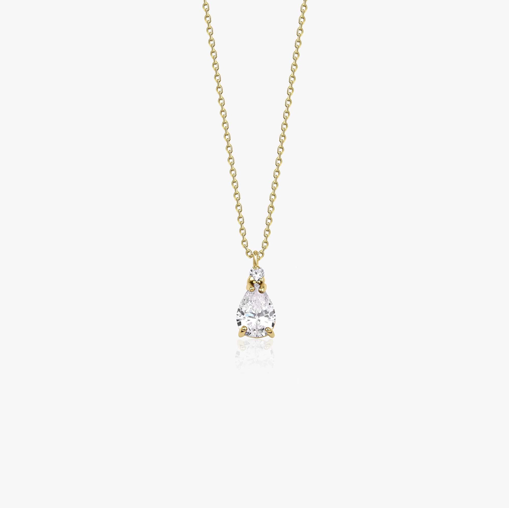 A 14k yellow gold white drop necklace shown in white background.