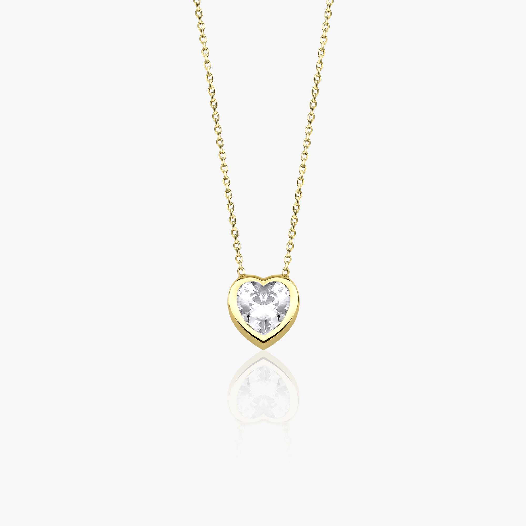 A 14k yellow gold necklace with a heart-shaped cubic zirconia pendant on a white background
