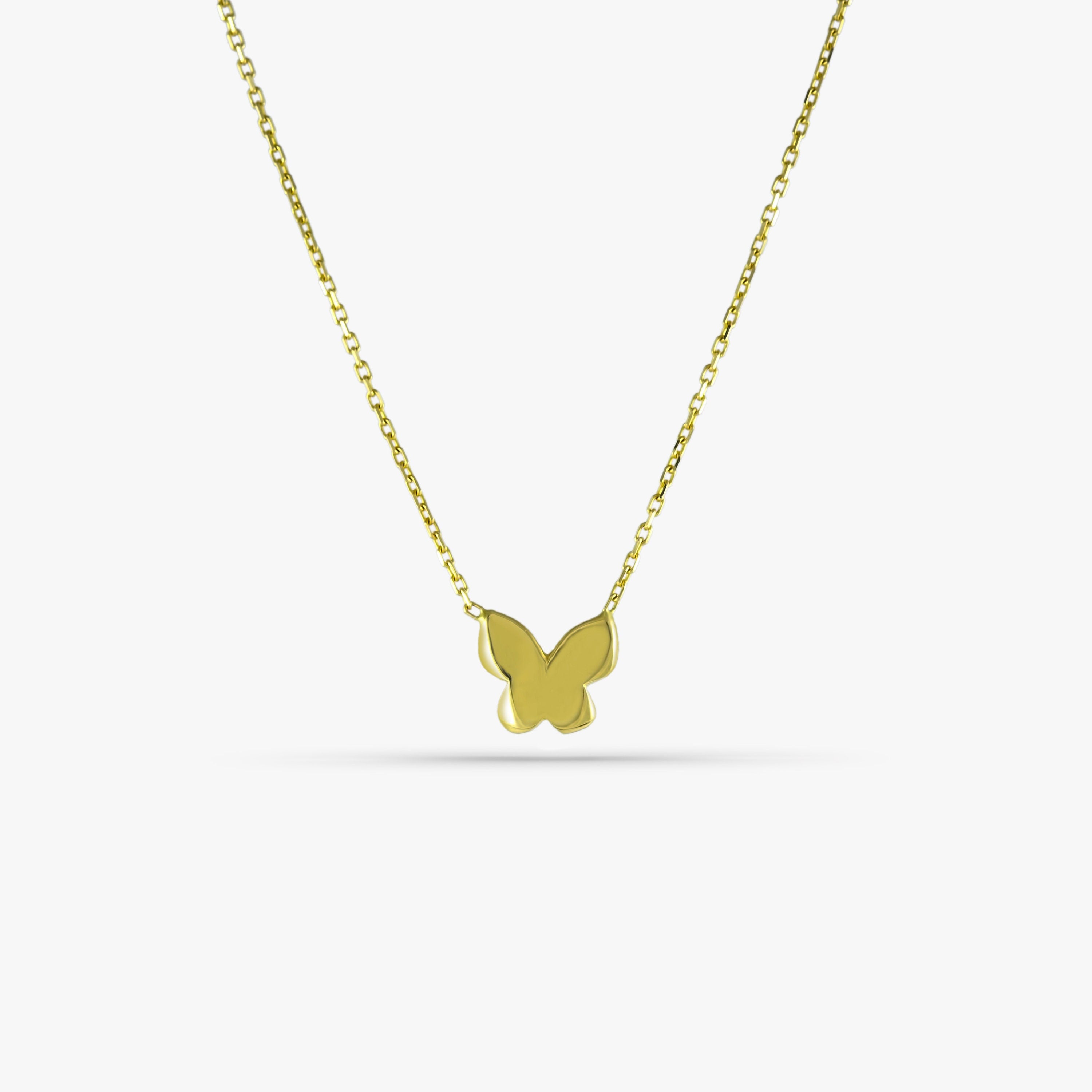 A dainty 14k solid gold butterfly necklace on a chain, with a yellow gold hue and a simple, elegant design.