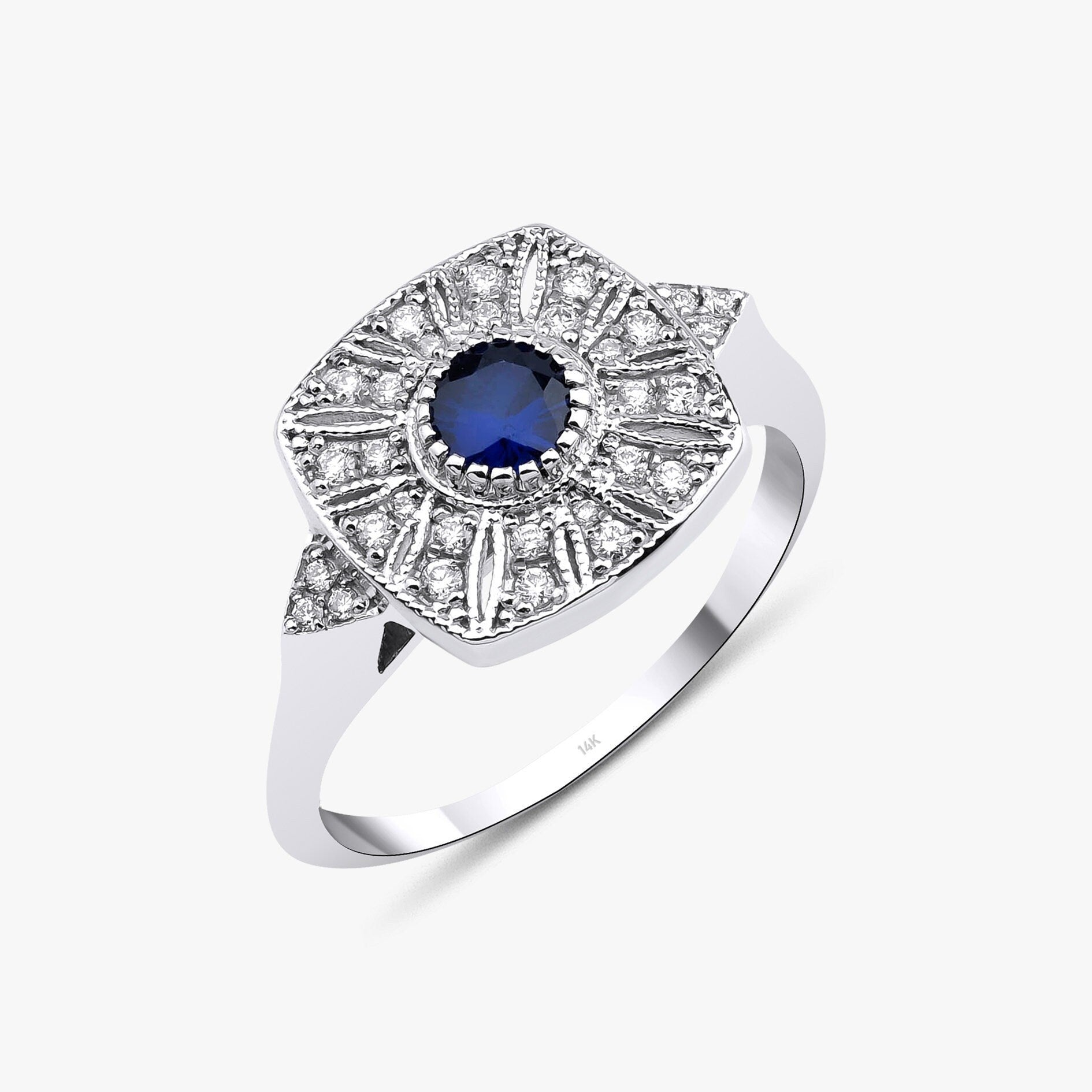 Round Cut Sapphire and Diamond Ring in 14K Gold